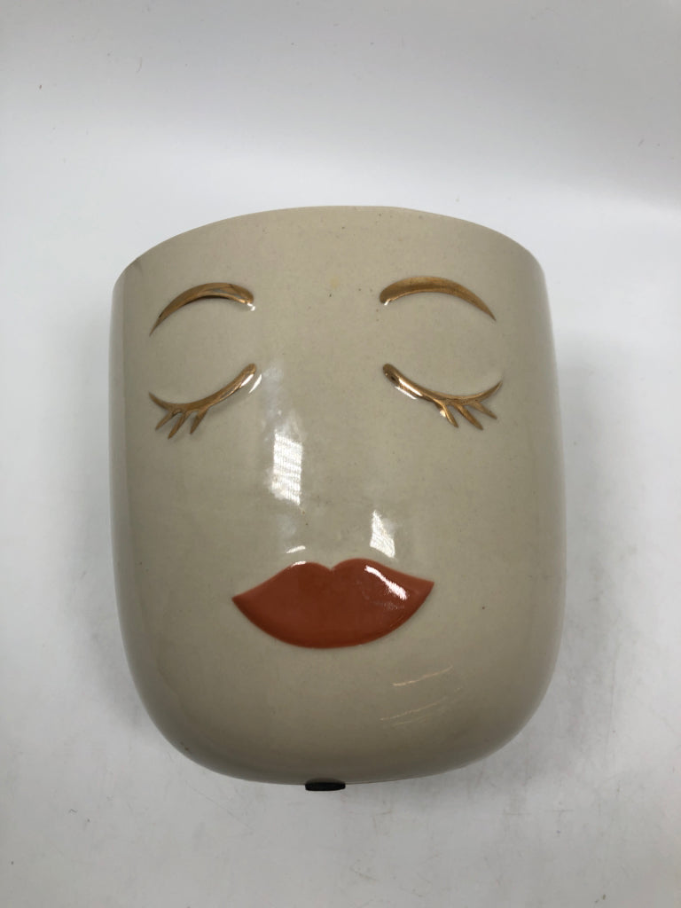 CERAMIC FACE PLANTER.