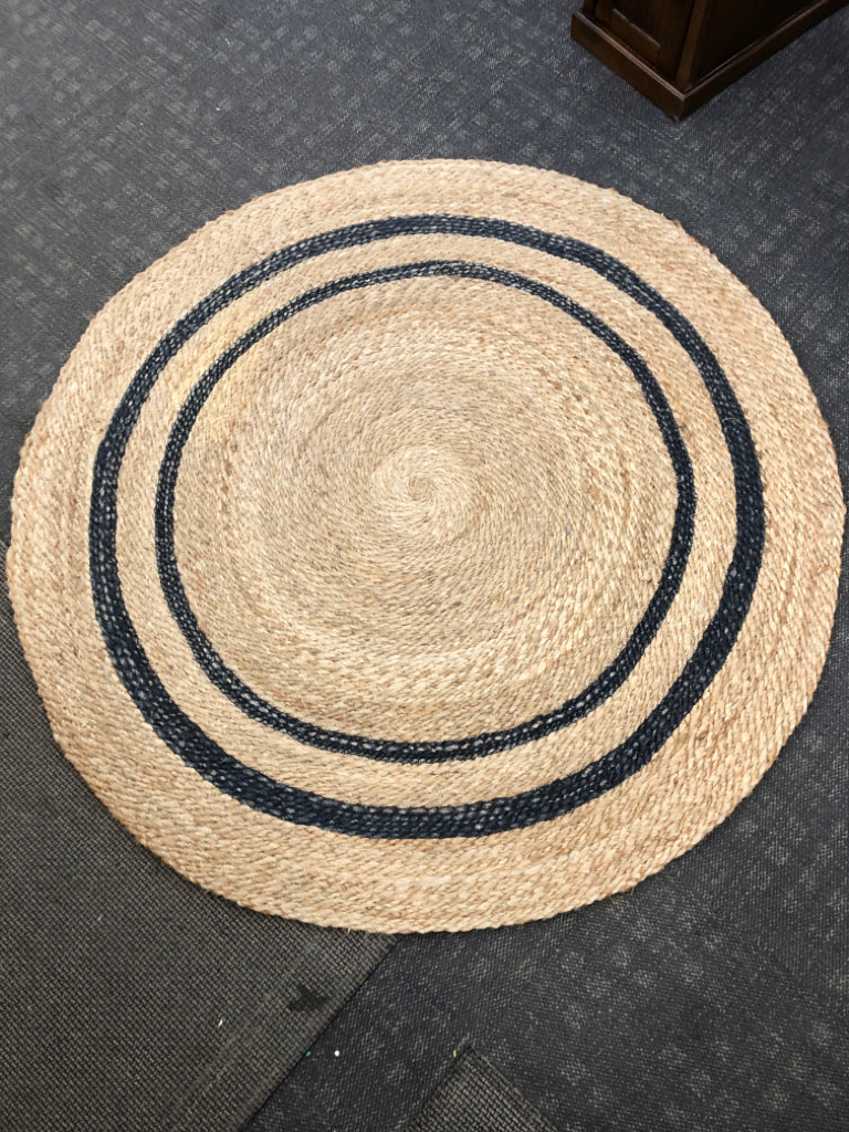BLACK STRIPED WOVEN JUTE AREA RUG.