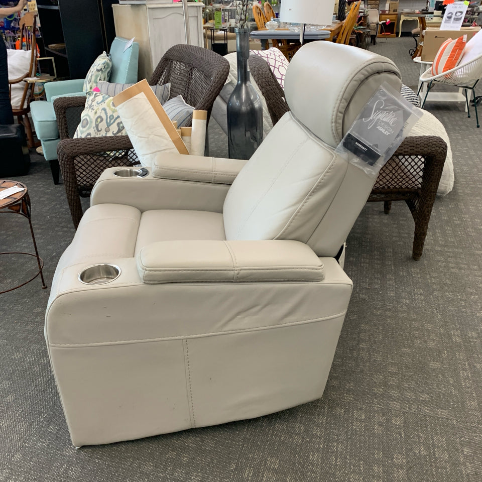 ASHLEY FURNITURE CREAM LEATHER RECLINING LOUNGE CHAIR W/TAGS.