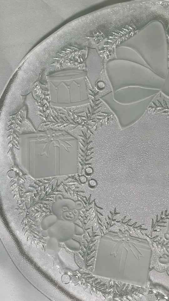 FROSTED EMBOSSED BOW AND TOYS ROUND PLATTER.