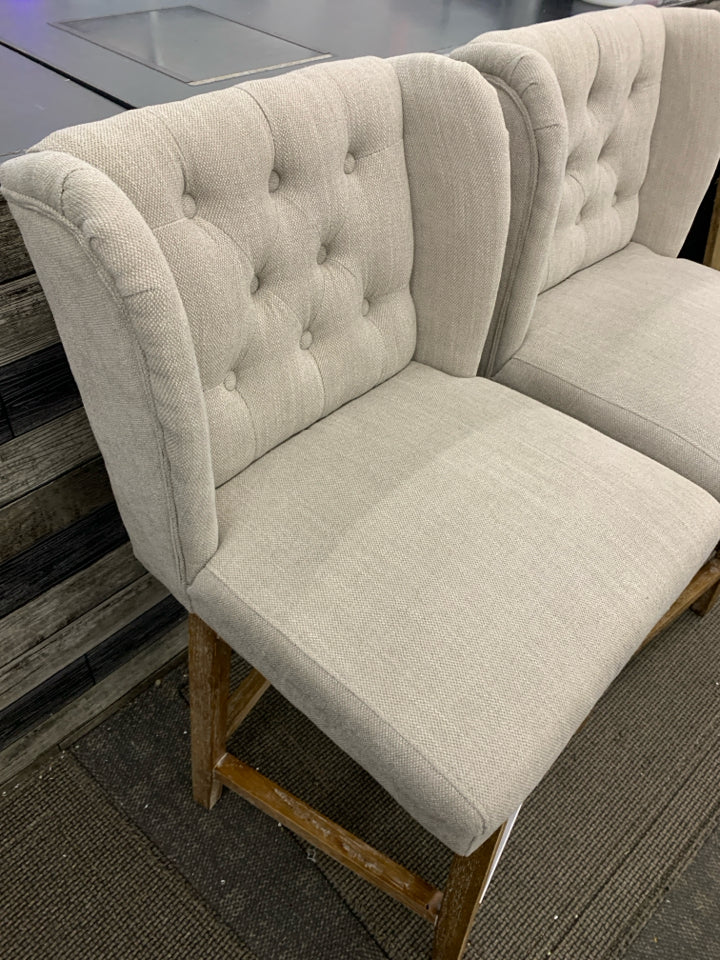 2 GRAY UPHOLSTERED SWIVEL CHAIRS.