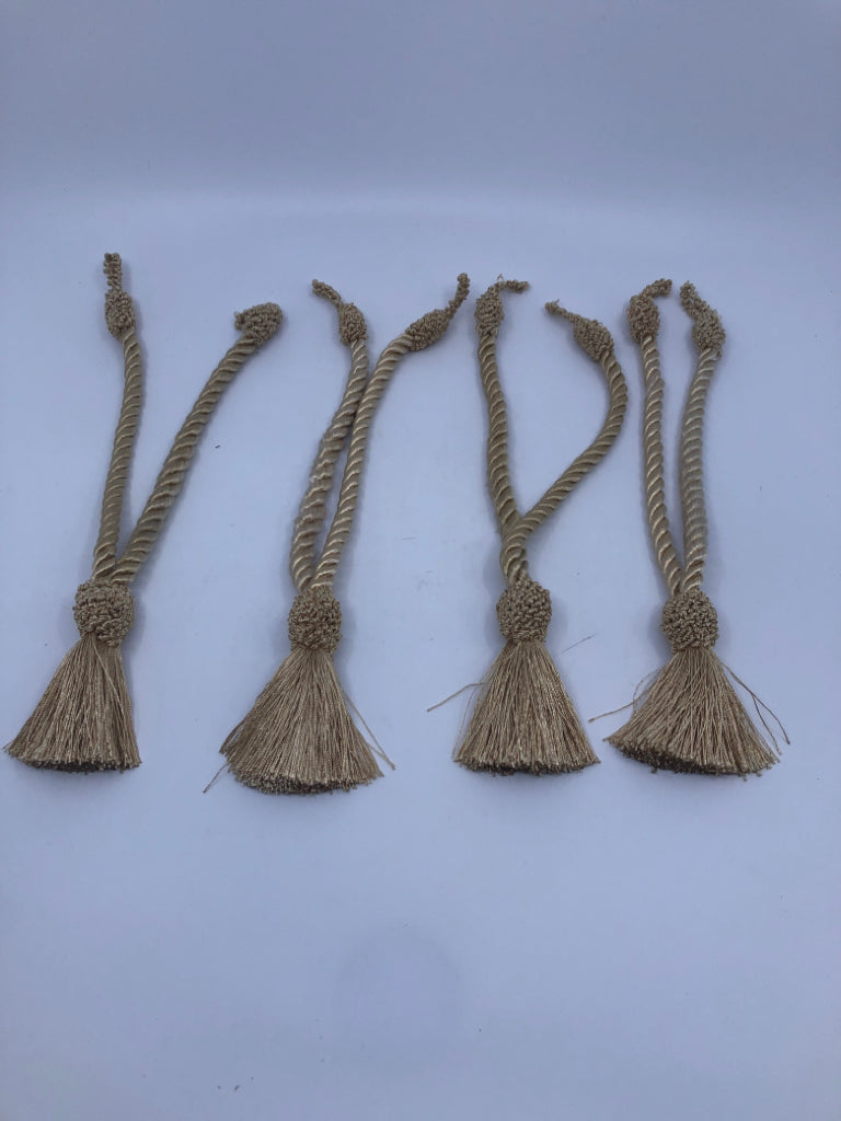 4 GOLD CURTAIN TIE BACKS.