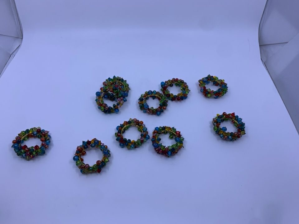 10 MULTI COLORED BEADS NAPKIN RINGS.