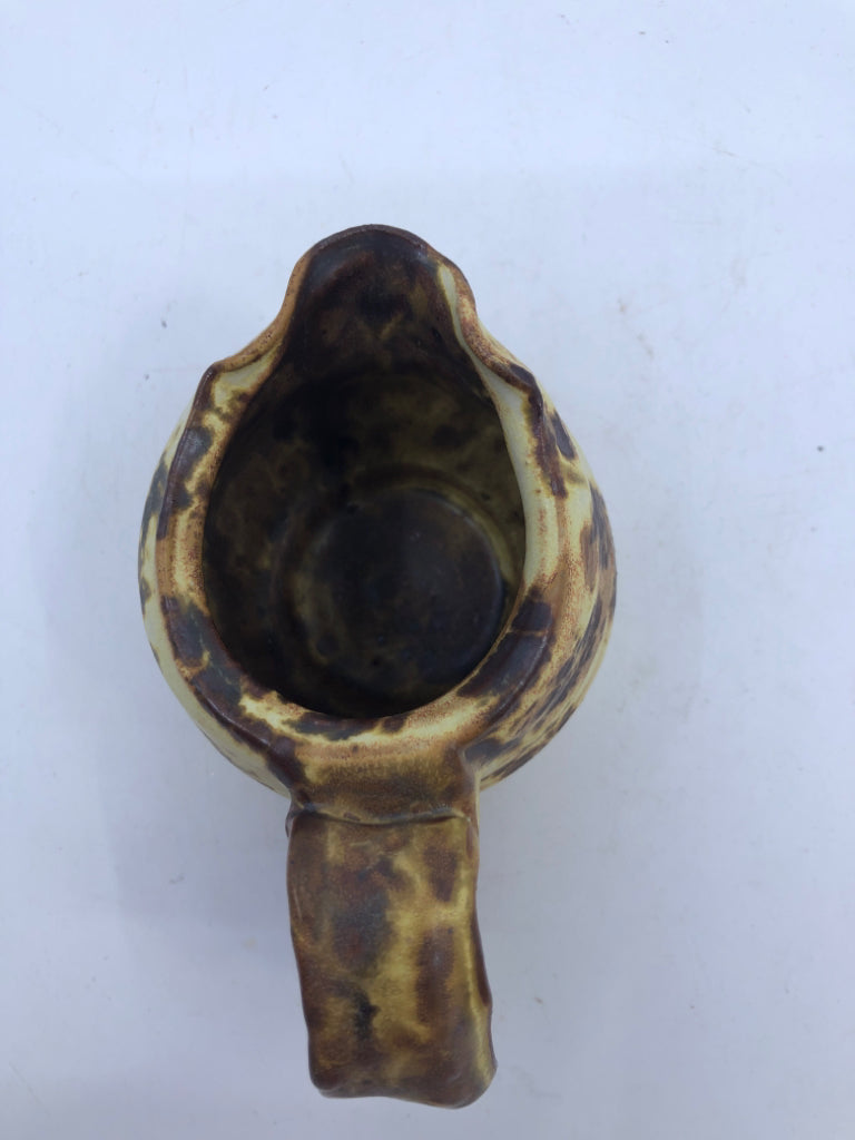 BROWN AND YELLOW COW PATTERN CREAMER.