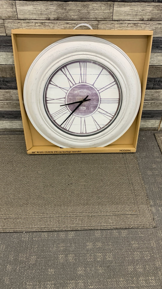NIB WHITE WASHED PLASTIC WALL CLOCK.