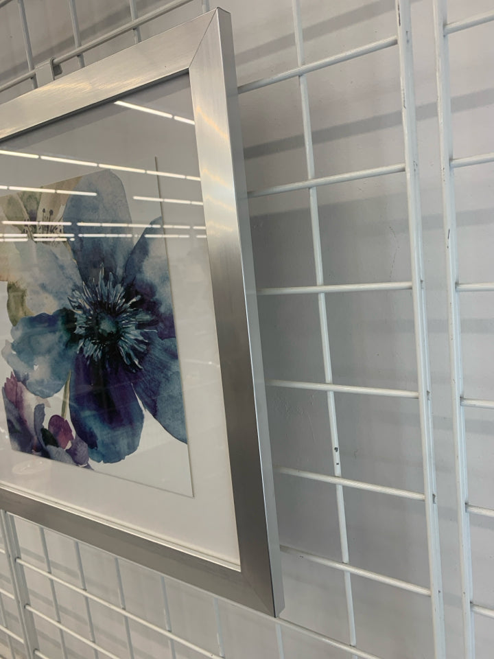 BLUE WATERCOLOR FLOWER IN SILVER FRAME.