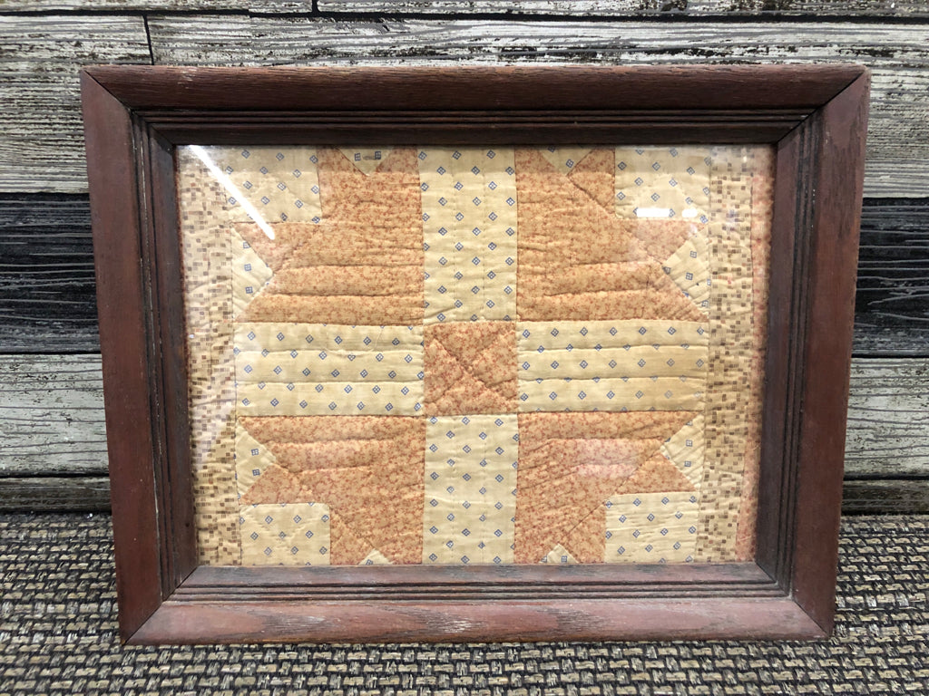 PRIMITIVE QUILT PIECE IN FRAME.