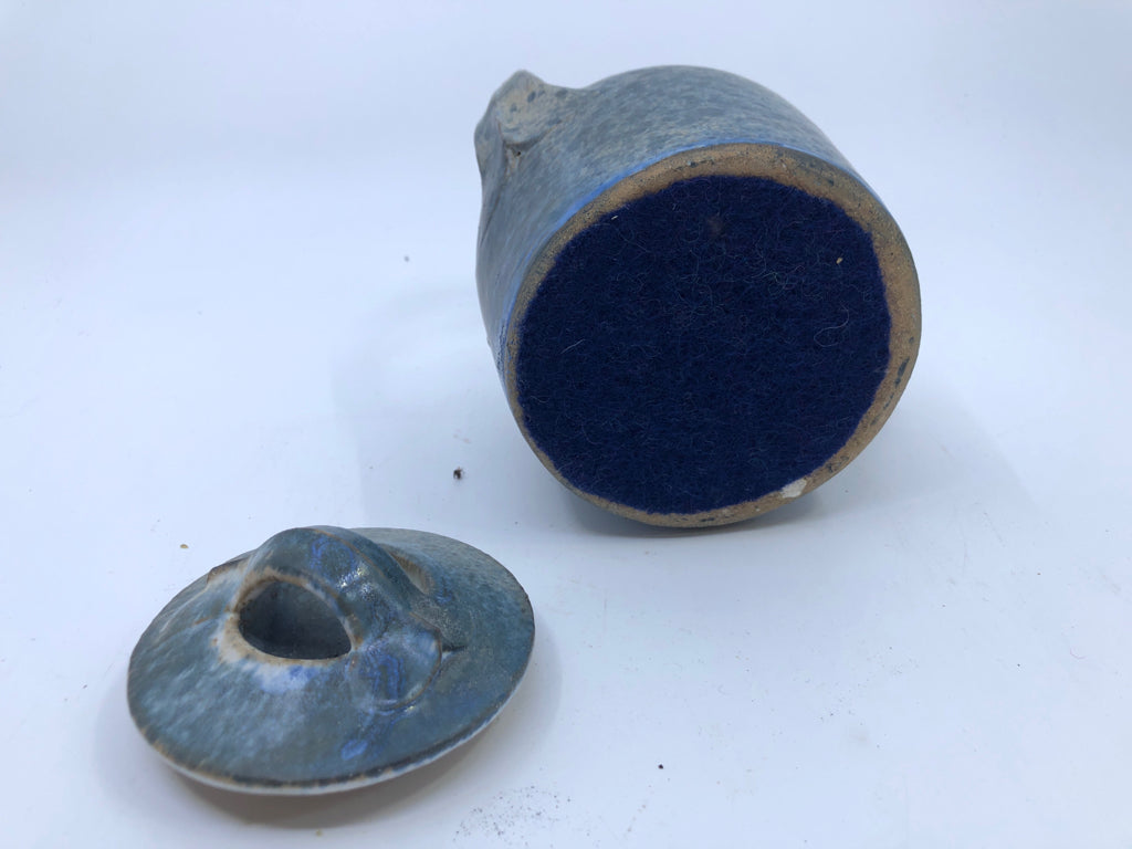 SMALL BLUE HEAVY POTTERY TEA POT W/ TAN DETAILS.