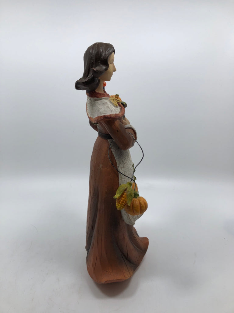 WOMAN HOLDING CORNUCOPIA "YOUNG" FIGURINE.