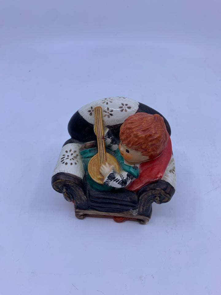 REDHEAD KID PLAYING BANJO ON CHAIR FIGURE.