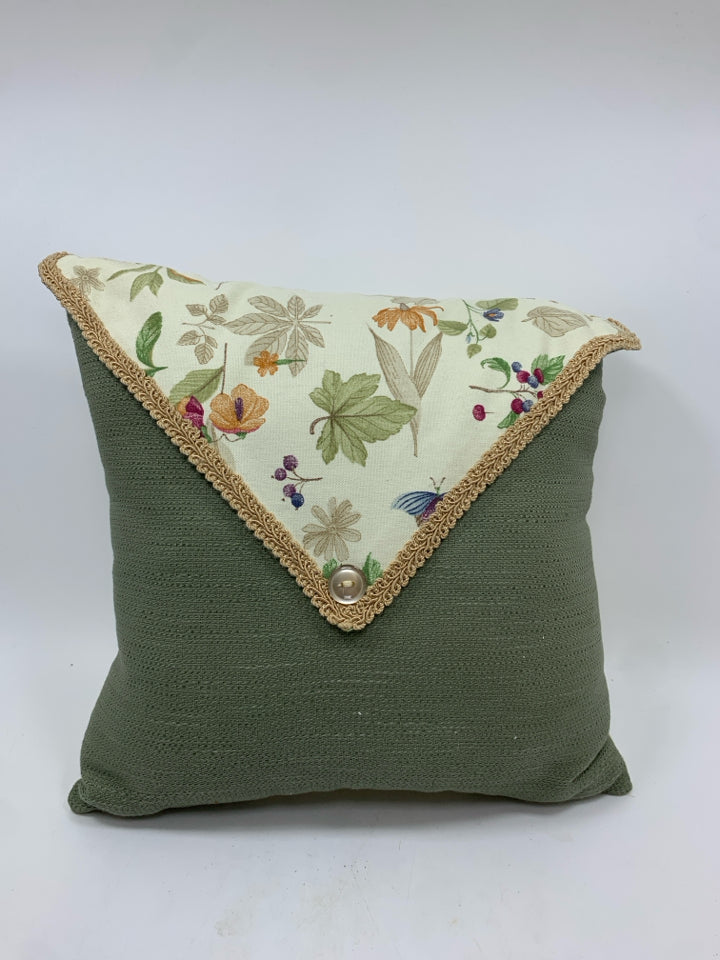 FLORAL THROW PILLOW WITH ENVELOPE DESIGN.