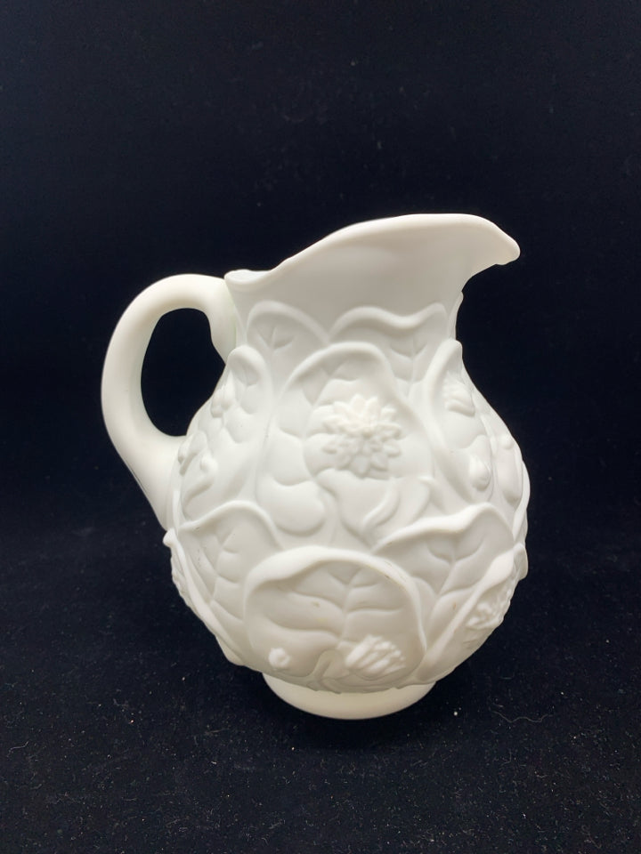 WHITE EMBOSSED FLORAL PITCHER.