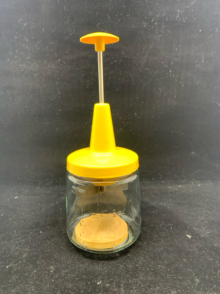 VTG YELLOW FOOD CHOPPER.