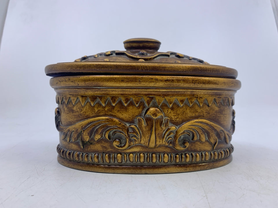 OVAL HEAVY BRONZE/GOLD EMBOSSED SCROLL COVERED TRINKET BOX.