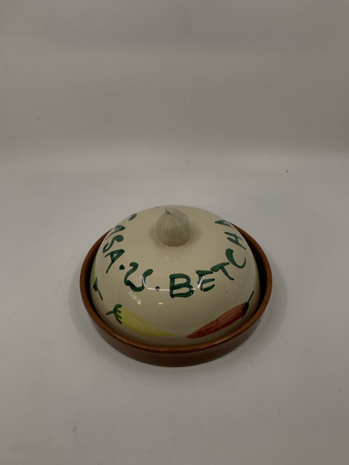 TERRA COTTA TORTILLA WARMER W/ PEPPERS ON IT.