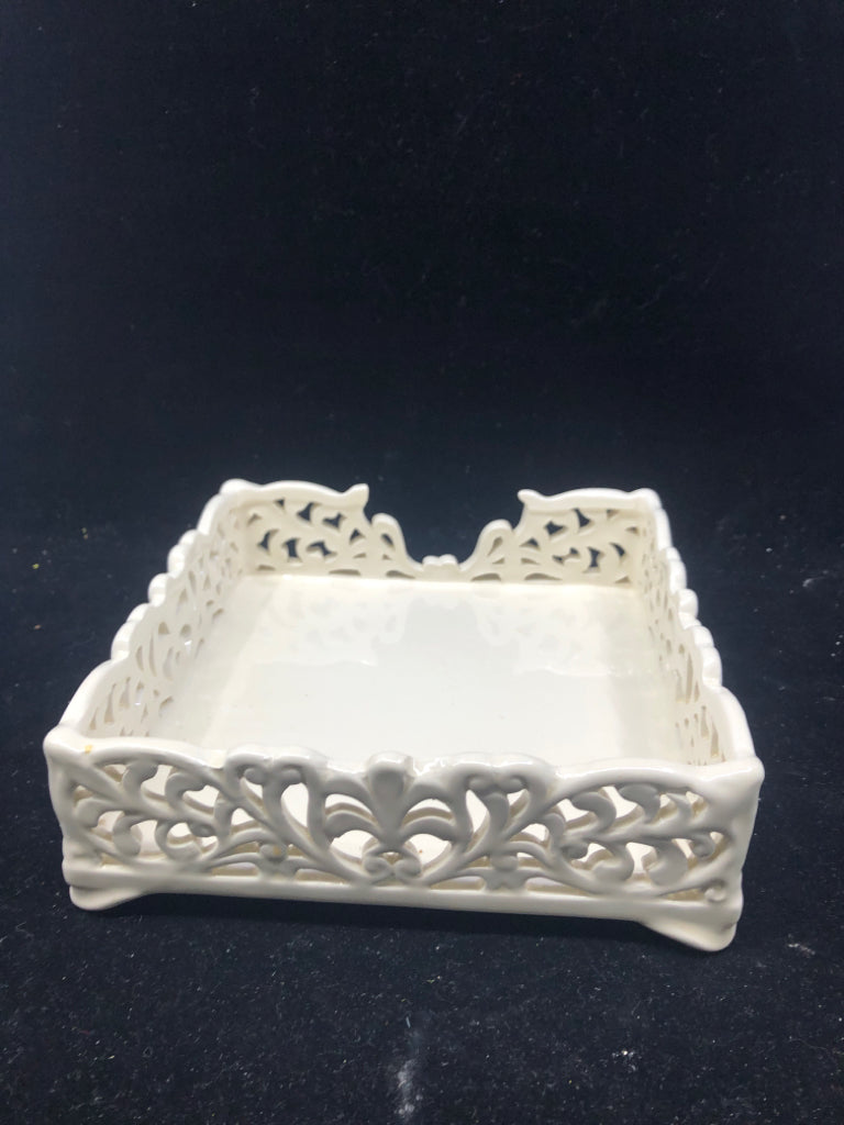 WHITE SCROLL CUT OUT NAPKIN HOLDER.