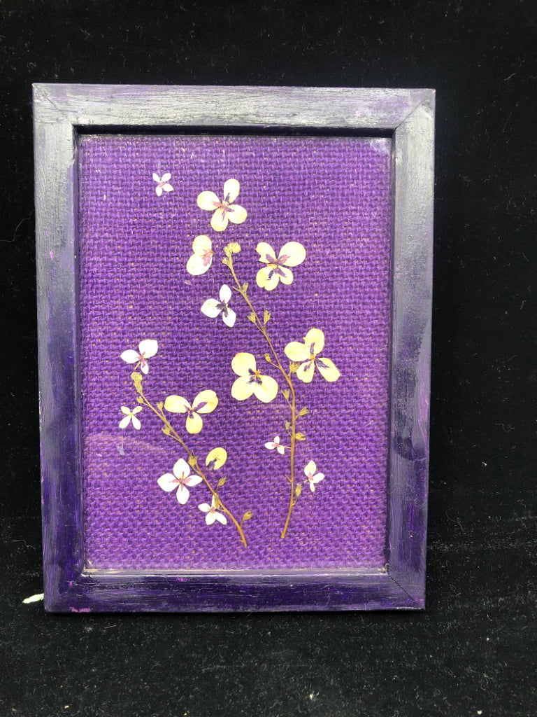 DRIED FLOWERS IN PURPLE FRAME.