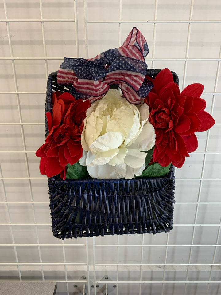 RED WHITE AND BLUE BOUQUET IN BLUE BASKET.