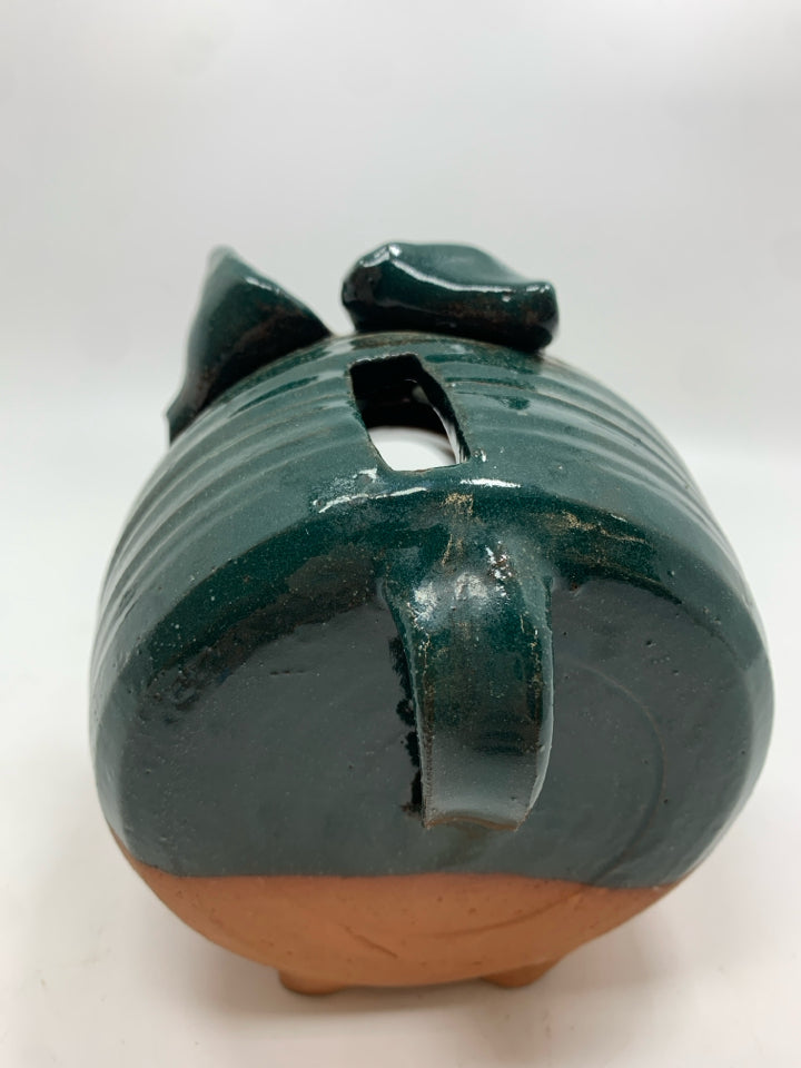 TERRA COTTA PIGGY BANK W/GREEN GLAZE.