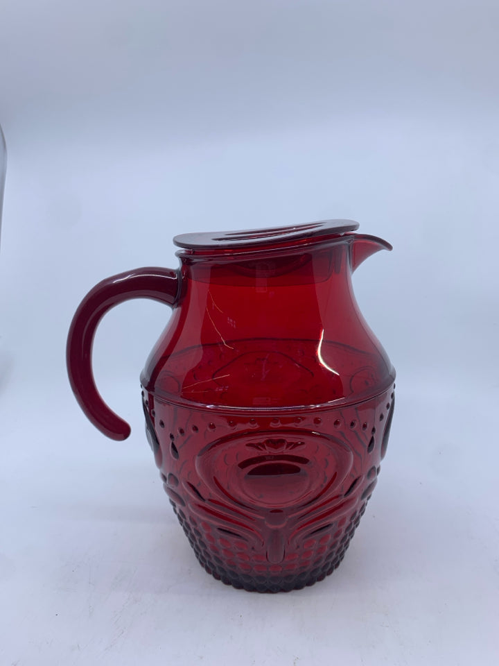 RED EMBOSSED PLASTIC PITCHER.