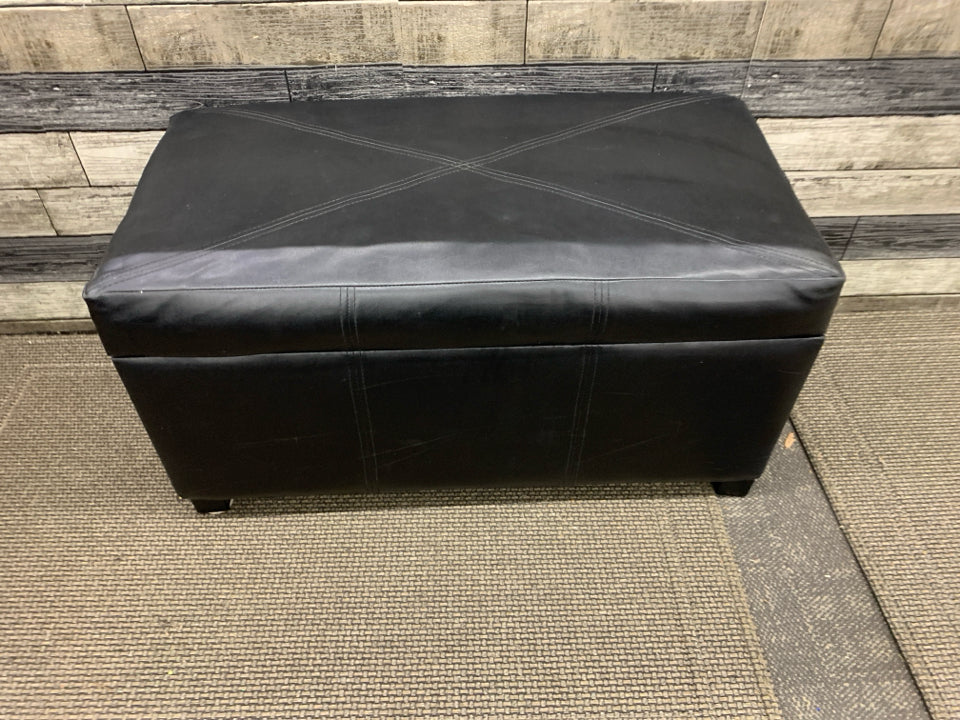 FAUX BLACK LEATHER BENCH W/ FLIP TOP STORAGE.