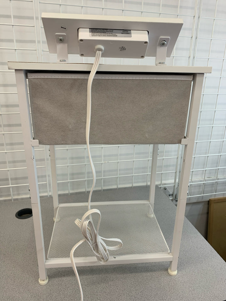 WHITE METAL FRAME NIGHTSTAND W/FABRIC DRAWER POWER OUTLET.