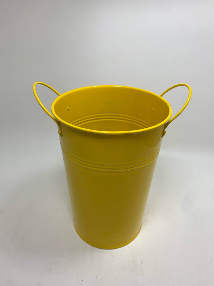 YELLOW METAL BUCKET.