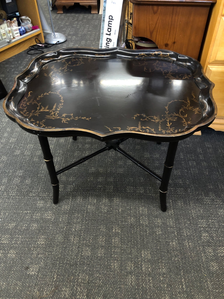 DARK BROWN TRAY TABLE W/ GOLD DETAILS.