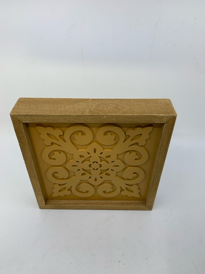 WOOD FRAME W/ ORANGE MEDALLION.