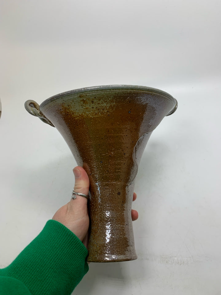 ABSTRACT VASE W/ CARVING INSIDE FLARED TOP AND SMALL HANDLES.
