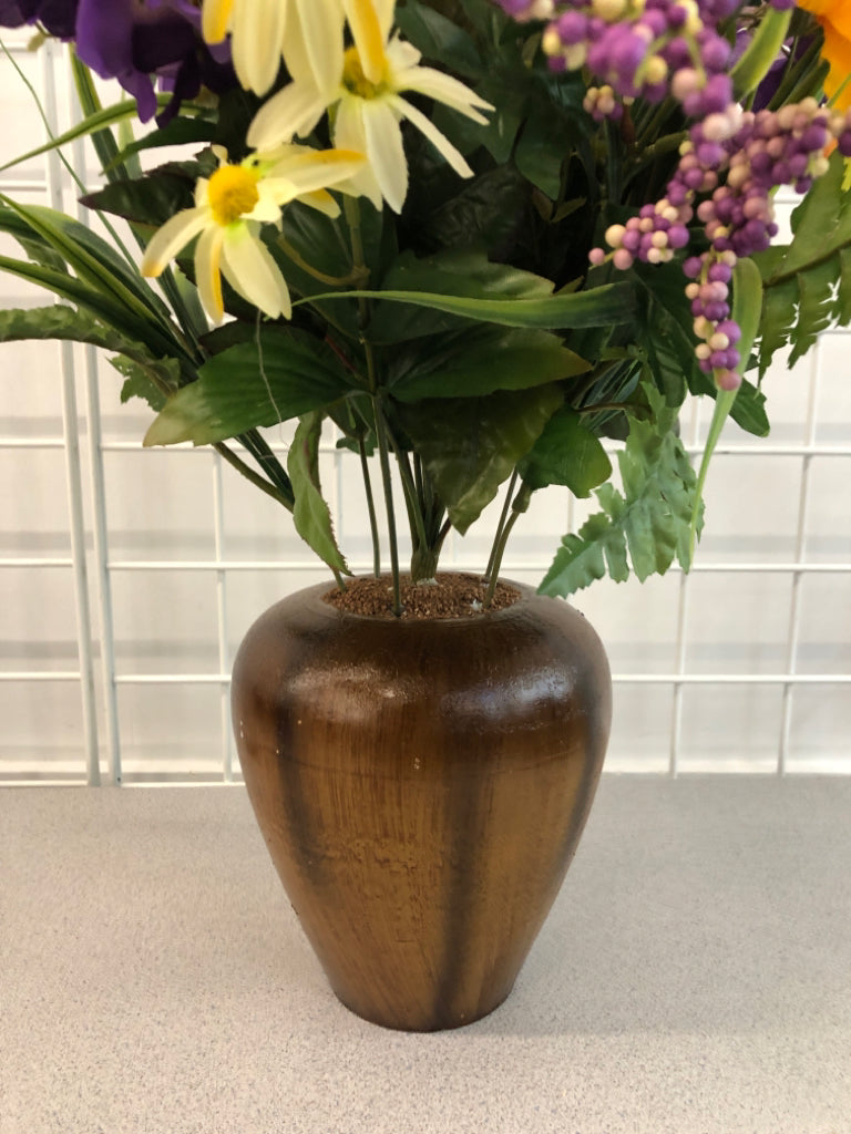 PURPLE/ORANGE FLOWERS IN BROWN VASE.