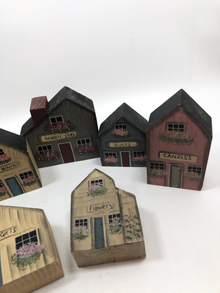 7 WOOD PAINTED BLOCK HOUSES IN BAG.