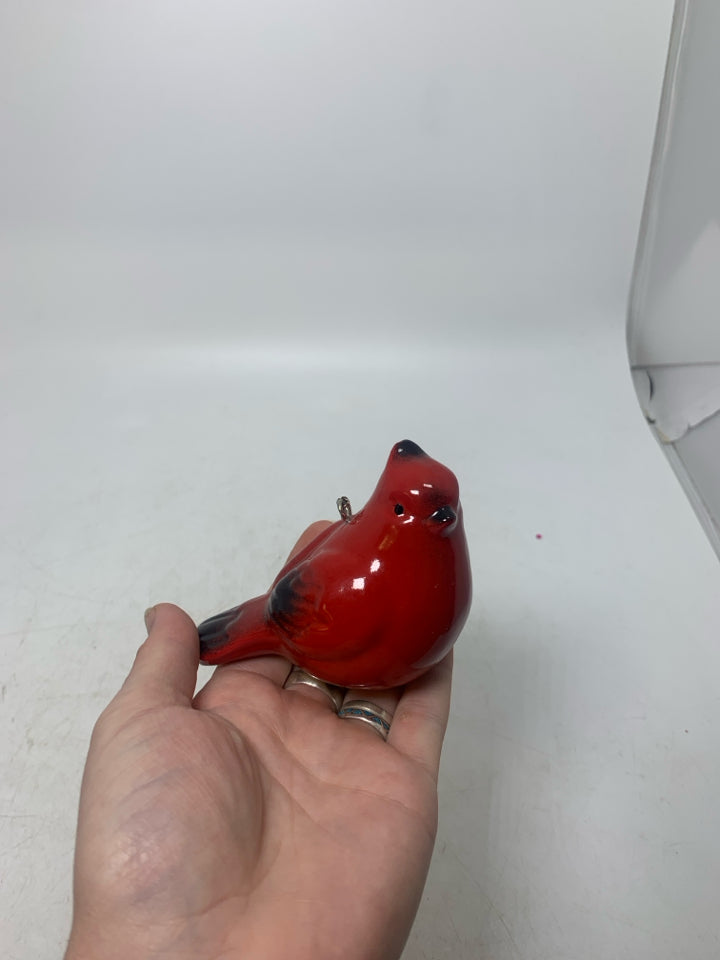 RED CERAMIC CARDINAL ON BUNGLE STRING.