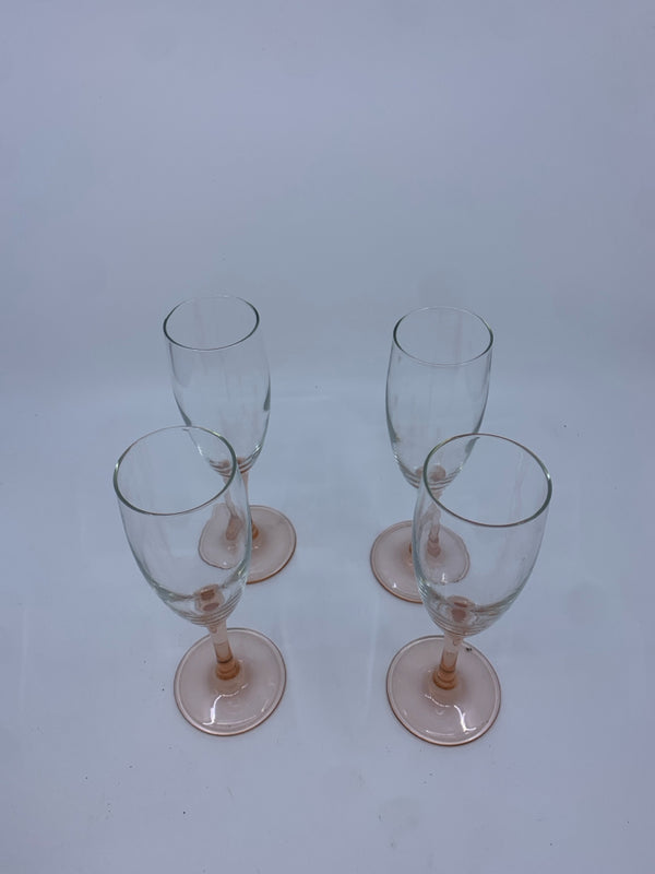 4 CHAMPAGNE FLUTES WITH PEACH COLORED STEM.