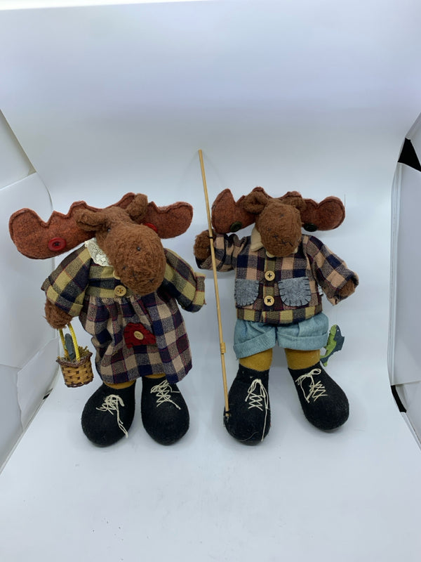 2 PLUSH MOOSE IN PLAID ON HOLDING FISHING GEAR HEAVY FEET.