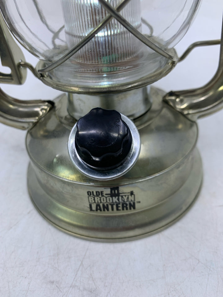 LIGHT WEIGHT SILVER METAL BATTERY POWERS LANTERN.