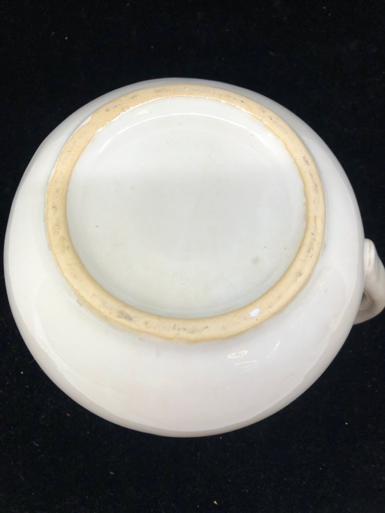 CREAM W SLIGHT EMBOSSED RIM PITCHER.