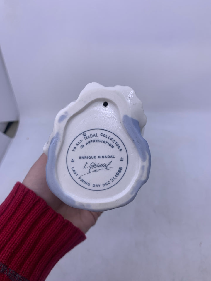 SITTING GIRL W/ ROSE IN HAND.