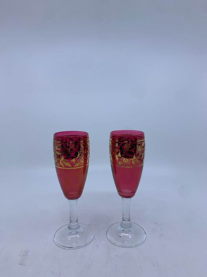 2 RED CHAMPAGNE FLUTES W/ GOLDEN FLOWER DESIGN MADE IN ITALY.