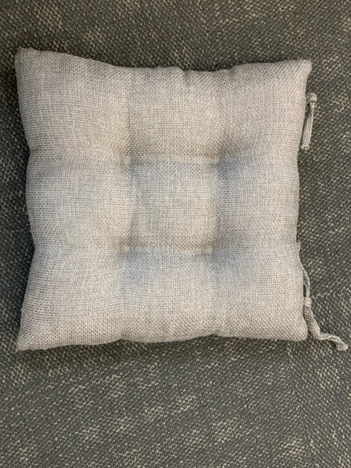 2 GREY TEXTURED CHAIR CUSHIONS.