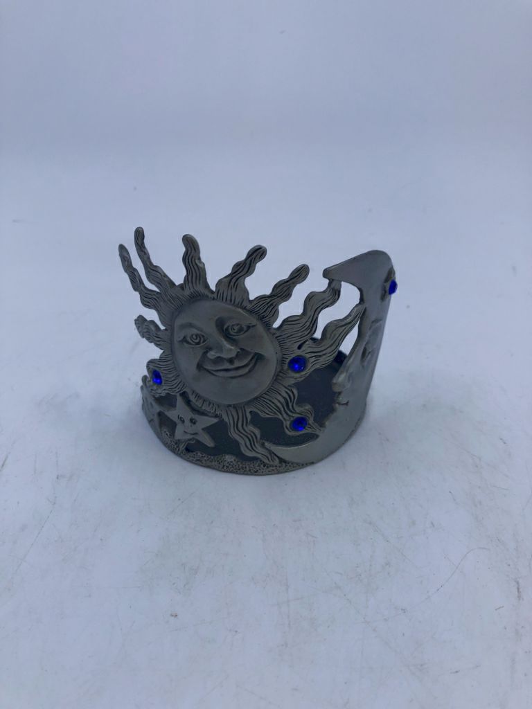 SUN/STAR METAL TEA LIGHT HOLDER.