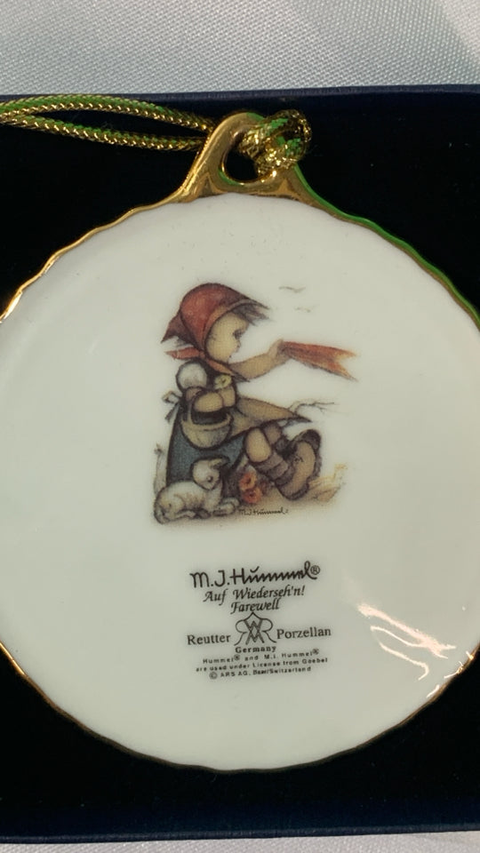 LITTLE GIRL HUMMEL ORNAMENT.