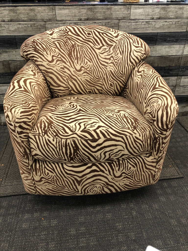 BROWN ZEBRA SWIVEL CHAIR.