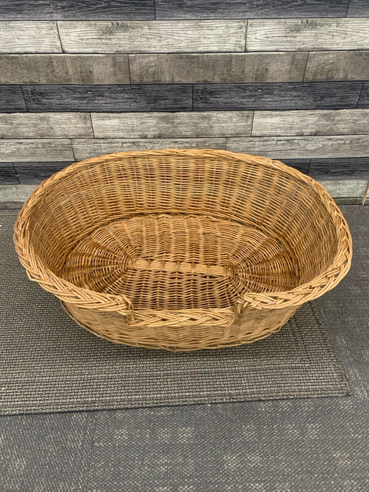 LARGE WICKER OVAL DOG BED.