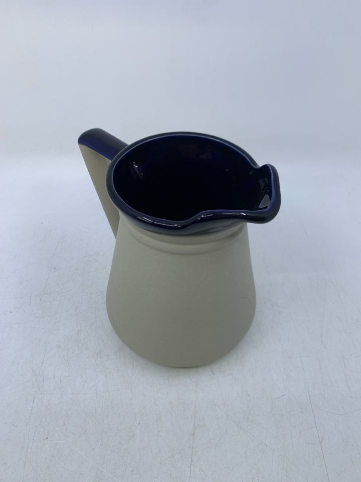 MATTE GRAY PITCHER W/ GLAZED COBALT BLUE INSIDE.