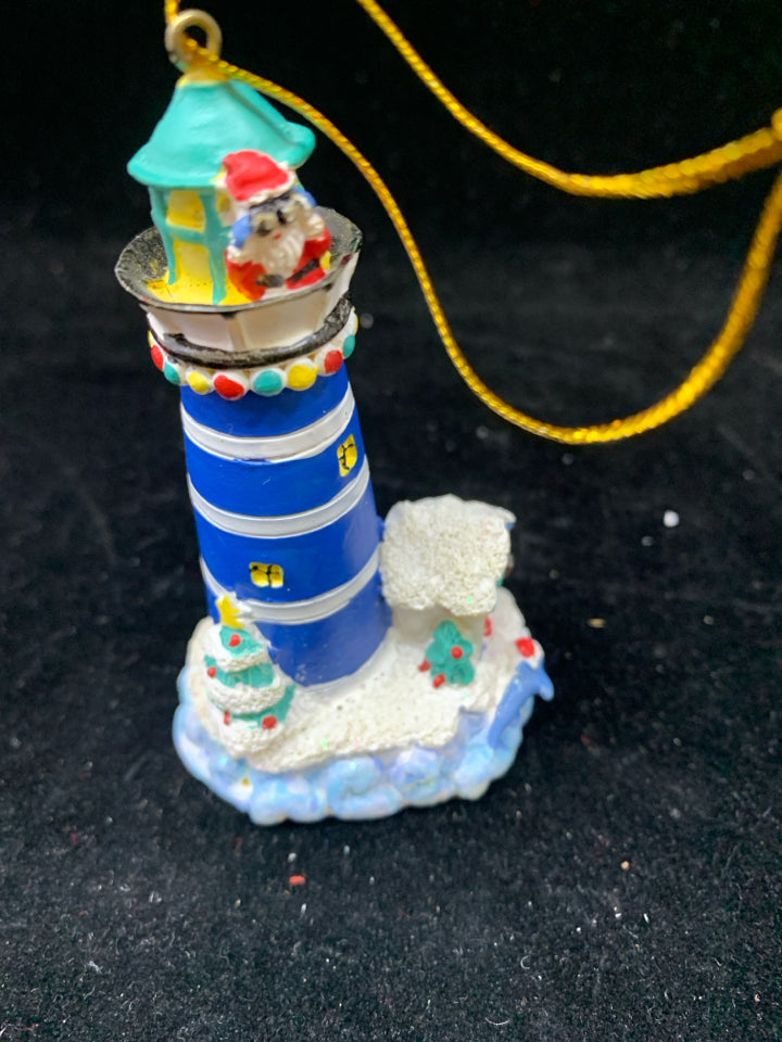 BLUE LIGHTHOUSE ORNAMENT W/SPYING SANTA.