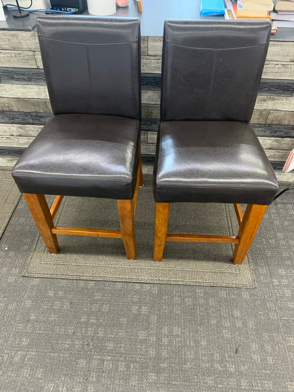 2 FAUX BROWN LEATHER COUNTER STOOLS.