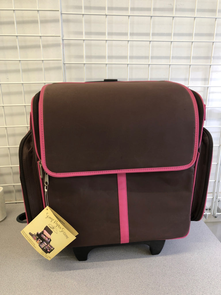 PINK AND BROWN ROLLING SCRAPBOOK CASE.