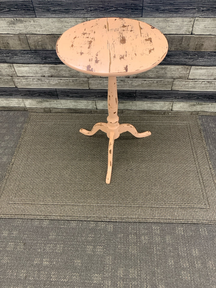 DISTRESSED PEACH AND WOOD ROUND SIDE TABLE.