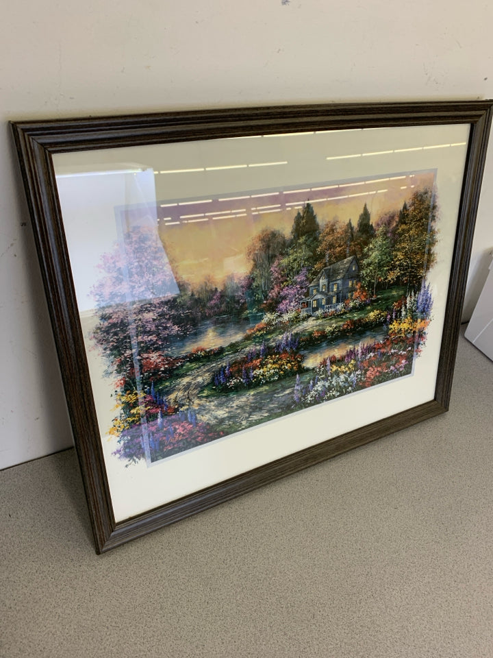 COLORFUL FLORAL COTTAGE SCENE IN DARK FRAME.